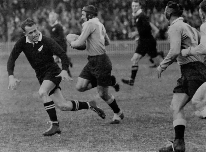 Dashing NSW centre, Trevor Allan, playing his first game against the All Blacks, cuts inside a defender at the Cricket Ground yesterday. June 22, 1947.