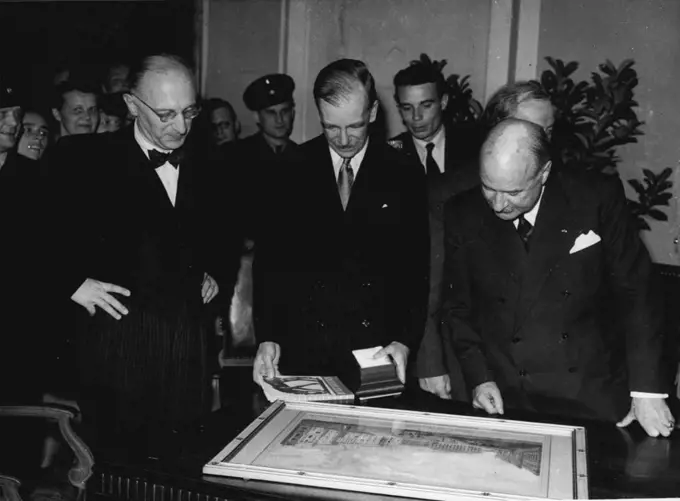 General Robertson Says 'Good-Bye' To Berlin., Addresses Session Of West Berlin Council -- General Robertson admiring a painting of Old Berlin, which was presented to him by Professor Reuter, Mayor of Berlin. On left is Dr. Suhr and on right M. Francois-Poncet.... General Sir Brain Robertson who is leaving Germany this week to take up an Army appointment in the Middle East, paid a special visit to Berlin to say good-bye to his many allied friends and Germans......During his short visit he addressed a special session of the West Berlin City Government in the Schoneberg Town Hall in the U.S. Sector. June 19, 1950. 