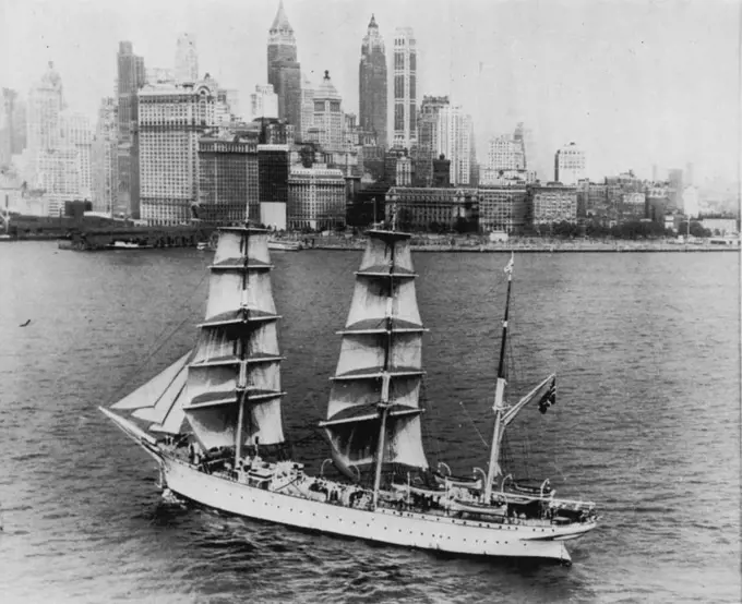 Norsemem Discover New York Skyline - The Norwegian barque Statsraad, carrying 180 would-be seadogs, glides past Battery Park and the towering skyline toward her anchorage after a 36-day voyage from Bergen, Norway. The majestic, three-masted anachronism on which 180 Norwegian youngsters are studying to be seamen arrived here yesterday to give waterfront viewers a very different thrill from that they received only a few days before when the liner United States ended her maiden, record-breaking voyage. July 18, 1952. (Photo by AP Wirephoto).