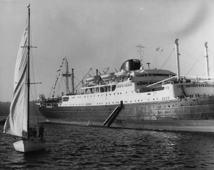 Tahitien Arrives On Maiden Voyage - The French liner Tahitian is welcomed to Sydney by this yacht when it arrived today on its Maiden voyage from France. June 25, 1955. (Photo by George Lipman/Fairfax Media).