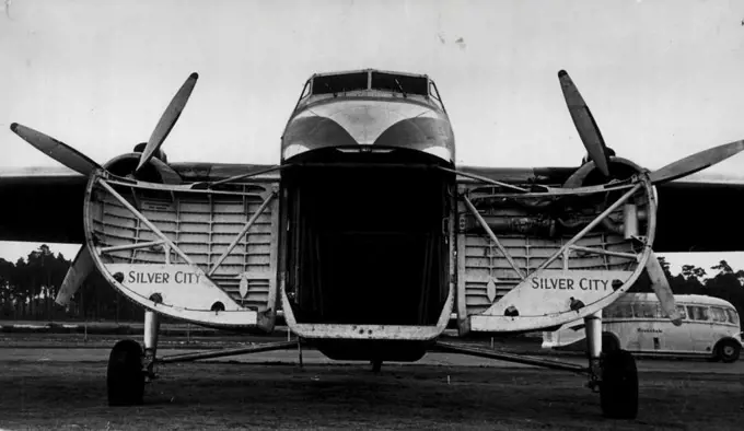 The ample freight area of the planes admirably suits Powell. In it he can pack cars or tons of cased produce for speedy and safe delivery. March 25, 1953. 