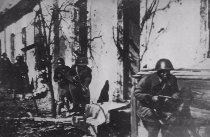 Red Troops On Alert In Stalingrad -- With guns at the ready position, Russian Troops Reconnoitre an area in the outskirts of Stalingrad. Moscow reported today the city's defenders have repulsed heavy attacks made by two fresh German divisions. October 25, 1942. (Photo by AP Wirephoto).