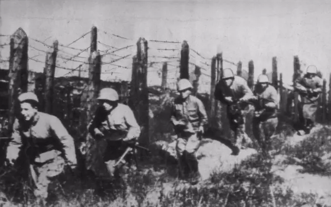 Stalingrad's Defenders Move Up -- Red soldiers; fighting in defense of Stalingrad, move up to a new position behind barbed wire barricades. October 26, 1942. (Photo by AP Wirephoto).