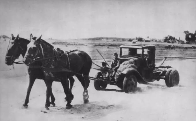 Nazis Save Fuel On The Russian Front -- From London source comes photograph described as picturing Nazi method of conserving valuable casoline rations on the Stalingrad front. Engine of truck is removed and fodder is carried beside driver to feed horsepower. October 26, 1942. (Photo by AP Wirephoto).