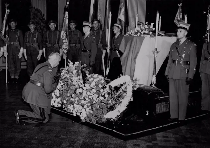 General Sikorski Lying In State In London -- General K. Sosnkowski (C-in-C) successor to General Sikorsko, pays homage at the lying-in-state today. In a plain coffin draped in the Polish flag, the remains of General Sikorski were brought to London yesterday, where the body will lie in state at the Polish Government H.Q. in Kensington Palace Gardens, London S.W. July 12, 1943. (Photo by Fox Photos).