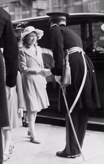 Royal Princess Attend Royal Tournament -- Princess Elizabeth being received on arrival. Queen Mary took Princess Margaret Rose and Princess Elizabeth to witness the Royal Tournament at Olympic this afternoon (Mon). June 13, 1939. (Photo by London News Agency Ltd.).