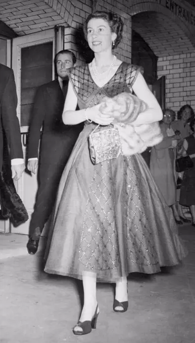 ***** Queen, leaving Wyndham's Theatre, London, after seeing 'The Boy Freind' this evening (Tuesday). Her Majesty watched the musical comedy, which is in the style of the 1920's, from a seat in row 'E' of the stalls. August 3, 1954.