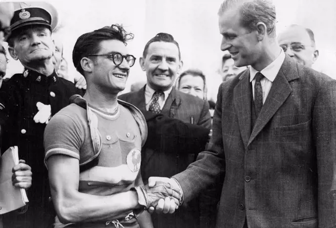 Olympic Games - France Wins Cycle Road Race At Windsor -- The Duke of Edinburgh shakes hands with J. Beyaert of France who won the gruelling 20-mile cycle road race at Windsor today (Friday) There were twenty five nations represented in the event which was started this morning by the Duke of Edinburgh. August 13, 1948. (Photo by Reuterphoto).