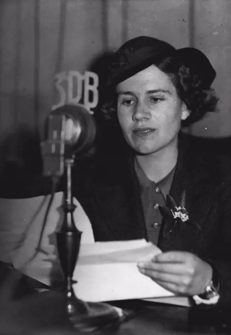 Miss J. Barrell broadcasting a geography lesson to children from Melbourne. August 2, 1937.