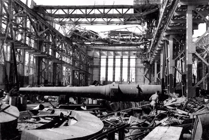 Captured Essen - The Siege gun which was never fired. First Pictures Inside Krupps. This picture taken by a Rap official photographer on April 11th, 1945, shows an interior view of the devastated Krupps works at Essen, one of RAF Bomber Command's chief targets during the War. May 21, 1945.