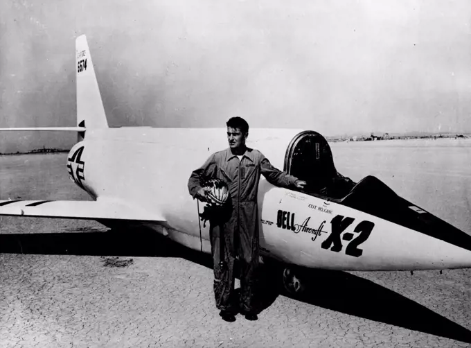 Bell's Supersonic X-2 To Probe Heat Barrier -- Lt. Col Frank K. Everest, top test pilot, who has been selected to fly the aircraft, with the Bell X-2. This Picture of the Bell X-2 is an American Rocket Powered research aircraft with swept-back wings. it is partly constructed of stainless steel to resist the tremendous heat due to air friction at extreme speeds. The X-1, an earlier model with straight wings, became the world's first supersonic aircraft in 1947, when Major Charles Yeager flew it faster than the speed of sound. August 12, 1955.