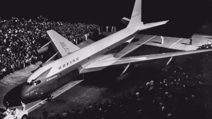 New Jet Transport Unveiled--The Nation's first big Jet transport plane, a 95-ton, swept-wing plane in the 550-miles-an-hour class, is rolled out of Boeing Airplane Company's nearby Renton plant to day after christening by Mrs. William E. Boeing. New jet "Stratoliner" is described as "tanker-transport prototype, "first of a line that may be used to refuel jet bombers in flight and eventually as commercial airliners that will carry 80 to 130 passengers. May 14, 1954. (Photo by AP Wirephoto).