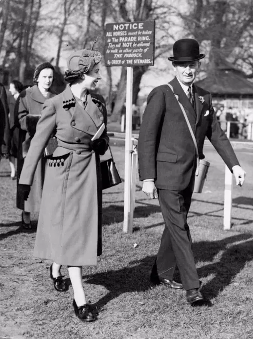 The Queen - In Sherry Coat And Hat - At The Races -- The Queen, wearing a deep sherry coat with hat to match, seen with one of the stewards, Sir Humphrey De Trafford, in the paddock at Sandown Park races today, where, with the Queen Mother, she is drove from Buckingham Palace to see the race for the Imperial Cup. March 14, 1953. (Photo by Reuterphoto).