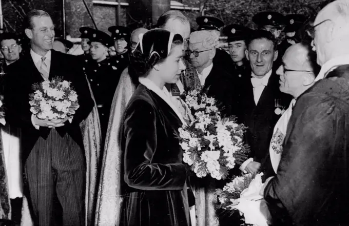 The Queen taking leave of the clergy after the service. On left is the Duke of Edinburgh. Both are seen carrying the traditional posies of Spring flowers. The Queen distributes the Royal Maundy. H.M. The Queen with the Duke of Edinburgh attended the annual distribution of the Royal Maundy Monies during the Service held this year at Southwark Cathedral, South London. during the Ceremony selected elderly and needy persons are presented with gifts commemorating each year of the Sovereign's life. April 7, 1955. (Photo by Sport & General Press Agency Limited).