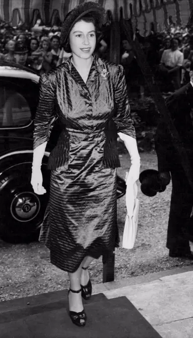 Elizabeth At London Wedding - Princess Elizabeth arriver at St. Peters church, Eaton Square London for the Wedding of one of her Bridesmaids, Lady Elizabeth Lambart to MP. Mark Longman, today. July 20, 1949. (Photo by Associated Press Photo).