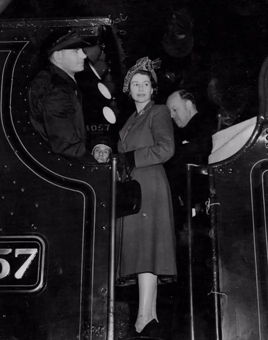 Princess Becomes Engine Driver - Princess Elizabeth standing on the footplate of an engine named after her when she visit the British Railway works at Swindon England today. She travelled on the engine from the works to Swinden station and helped to drive it during the journey. November 15, 1950.