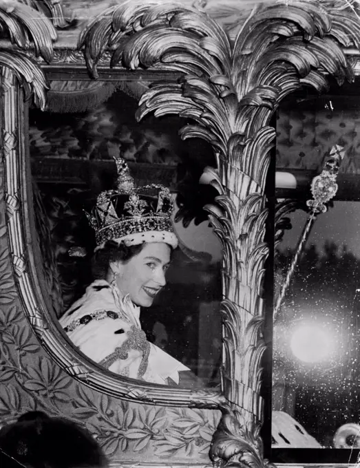 Smiling Queen Returns to Her Home - Smiling happily, the Queen rides in the golden State Coach into Buckingham Palace at the end of her triumphal progress from her Coronation at Westminster Abbey, London, to-day (Tuesday). She wears the Imperial State Crown, carries the Royal Sceptre and the Orb. Smiling Happily the Queen rides in the golden State Coach into Buckingham Palace at the end of her triumphal progress from her Coronation at Westminster Abbey. She wears the Imperial state crown. This picture reached Sydney today by record-breaking Qantas Constellation. June 02, 1953. (Photo by Reuterphoto).