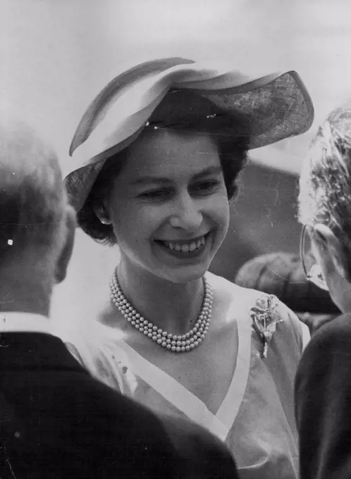 Queen Visits Sealer In London The Queen, in wide-brimmed summer hat, is greeted as she arrives to visit the Norwegian sealer Tottan at Tower Pier, London, to-day (Tuesday). The ship is to carry 25 British explorers to North Greenland. Main objected of the 100,000 expedition will be to test Service equipment under Arctic conditions and seek scientific and geological information. July 1, 1952. (Photo by Reuterphoto).