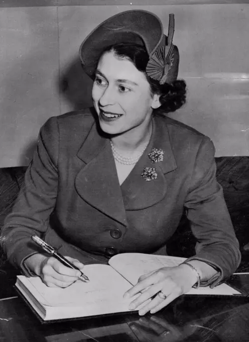 Royal Guest This Charming study of Princess Elizabeth was made as she signed the Royal Canadian Air force guest book while making the flight from montreal to Washington aboard an race plane; October 31. November 7, 1951. (Photo by Associated Press Photo).