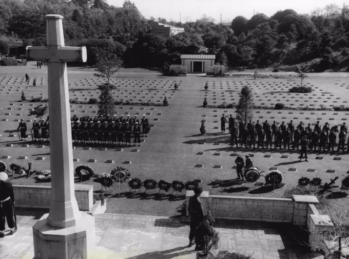 At Remembrance Day Ceremonies held at the Commonwealth War Cemetery Yokohama Japan, wreaths were laid at the Shrine of Remembrance by Senior Diplomats in Japan and Army representatives. Here wreaths and two Guards of Honour line the front of the Shrine of Remembrance at the Commonwealth War Cemetery at Yokohama on the occasion of Remembrance Day, while Sentinels Flank the Cross. November 23, 1954. (Photo by Brit Com PR Photo)