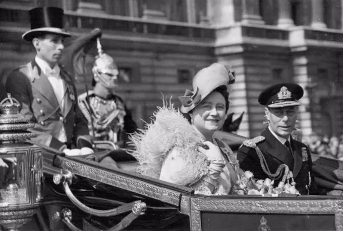 Silver Drive In Golden Sunshine -- T.M. The King and Queen in their laundau during their silver wedding drive this morning.The King and Queen drive to St. Paul's Cathedral for their Silver wedding service through a vast mass of people gathered to cheer and congratulate Their majesties. April 26, 1948.