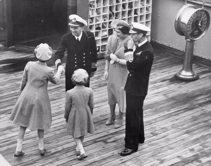 The King and Queen Home Again Family Reunion At He Docks -- With the guns of the home fleet booming a great welcome home, the King and Queen, after their triumphant tour Canada and the United States, landed at Southampton this afternoon.Their Majesties with the Princesses on the Empress of Britain. June 22, 1939. (Photo by Sport & General Press Agency, Limited).