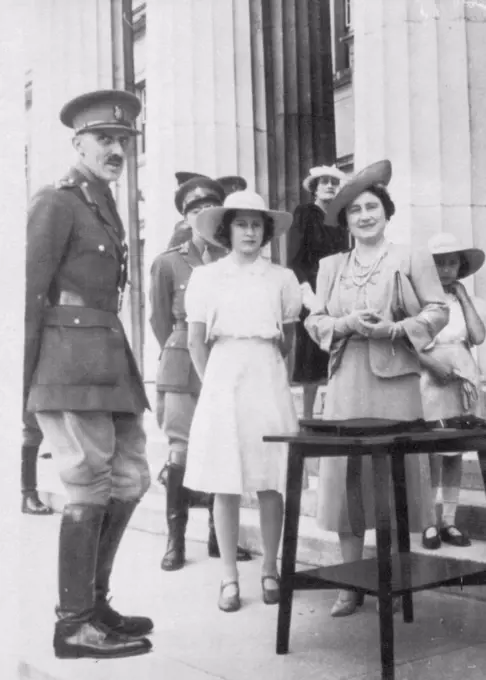 Queen Elizabeth Visits College - Queen Elizabeth was accompanied by Princesses Elizabeth (left) and Margaret Rose (right) during a visit to Sandhurst college recently. The Queen addressed a United States Radio Audience today. August 10, 1941. (Photo by AP Wirephoto).