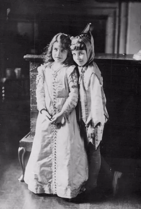 England's new Queen -- At the age of 9 -- This portrait study, made at Glamis Castle, Scotland, in 1909, shows Queen Elizabeth (then lady Elizabeth Bowes-Lyon) at the age of nine years. She is seen with her little brother David. Both are in fancy dress. December 18, 1936. (Photo by Associated Press Photo).