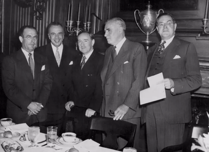 At American Australian Association Lunch -- Percy C. Spender, New Australian Ambassador to the United States (center) is guest of honor at a luncheon at the University Club, New York City, June 11, Given by the American Australian Association. Left to right: John D. Hickerson, Assistant Secretary of State, Myron M. Cowen, U.S. Ambassador to the Philippines and former Ambassador to Australia; Ambassador Spender; Sir Keith Murdoch, President of the Australian American Association and publisher of the Melbourne Herald and Mr. Edward E. Robbins, President of the American Australian Association. November 6, 1951. (Photo by Associated Press Photo).