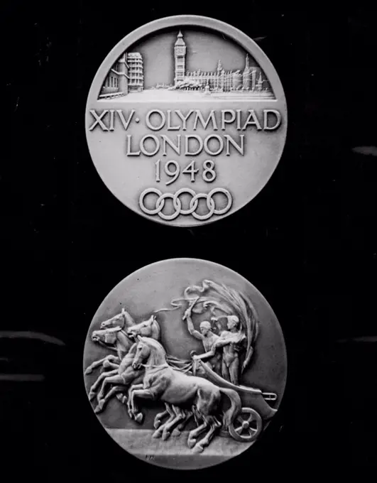 For the 1948 Olympiad -- The obverse and reverse of the Olympics medal, pictured today (Tuesday) at London factory of Messrs. John Pinches, responsible for their manufacture.Medals now being struck for successful competitors in the forthcoming Olympic Games, to be held in London, are to be of oxydised silver instead of gold, as hitherto. The medals which bear a symbolic Grecian chariot on the obverse, have depicted on the reverse an  impression of the Palace of Westminster, the fire interwined circles representing the five Continents, and the legend: XIV Olympied London 1948.Olympiad Medal. Austeritv medals for successful competitors in the 1948  Olympic Games, now being struck in London, are of a oxydised silver instead of gold, as ihtherto. January 27, 1948. (Photo by Reuterphoto).