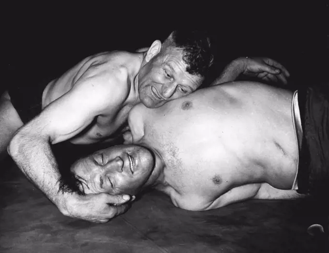 Wrestlong - Olympic Trials - J. Wilson (Dunfermline) and T. Baldwin (S. Forresters A.W.C) pictured during their middleweight bout in the British Amateur Wrestling Championships and final Olympic Trjals at Harringay today. May 16, 1952.