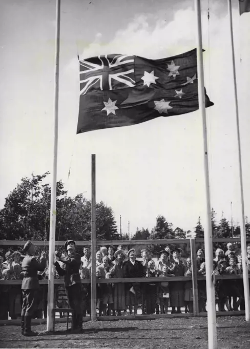 Australian Flag Raised at Helsinki - Finnish soldiers hoist the Australian flag in a ceremony at the Olympic village, near Helsinki, July 15. July 17, 1952. (Photo by AP).