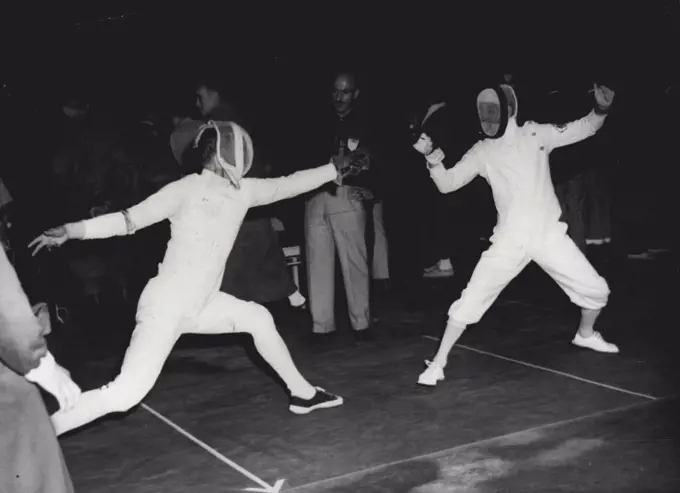 Olympic Team Foils Fencing - Sven T. Fahlman of Sweden (left) and Charles Stanmore of Australia are seen in action during the first round of the Olympic foil (team) event at the Westend, Helsinki. July 22, 1952. (Photo by AP).