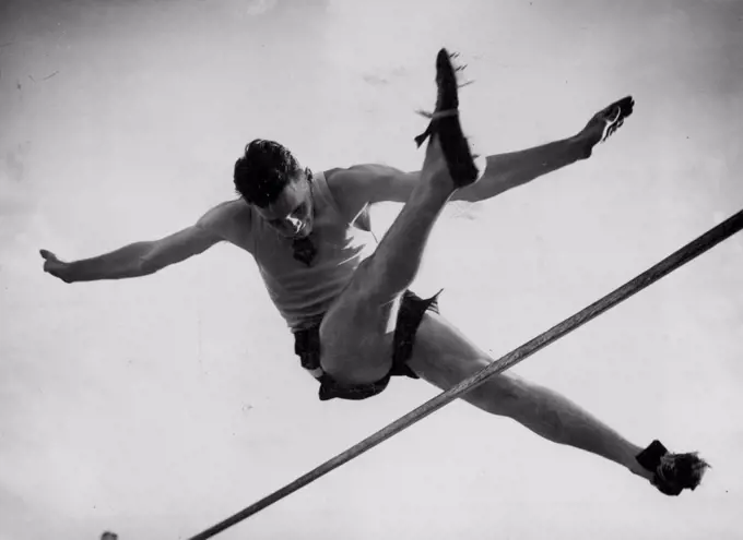 Doug Stuart (NSW) clears 6ft. 2in. in the Australian title high jump at Adelaide yesterday. The effort gained him only equal second place to Olympic winner, John Winter, who won yesterday with a jump of 6ft. 4in. January 3, 1950. 