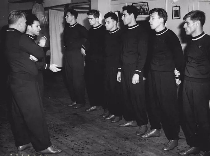 Russian Boxers Train Again - Members of the Russian boxing team here to fight against Great Britain at Wembley on Wednesday, receive instructions from their coaches during another spell of training at Blooms gymnasium today. October 10, 1955.