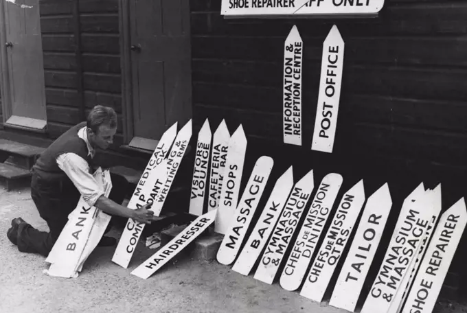 Olympic Accommodation - Sign painters are busy preparing the many signs needed for the guidance of competitors."Olympic Town" is being built in Richmond Park, Surrey, where final touches are now being put to the camp, where the participants in the Olympic games will be housed. May 29, 1948.