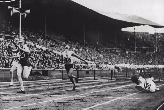 Olympic Games: British Hope Falls At Last Hurdle.Marie (France) first: Bernard Switzerland, second and Foster (Jamaica) third, in their heat of the 110 metre Hurdles, at Wembley. Don Finlay, the veteran British hurdler, is seen falling within a yard of the winning line. August 03, 1948. (Photo by Sport & General Press Agency, Limited).