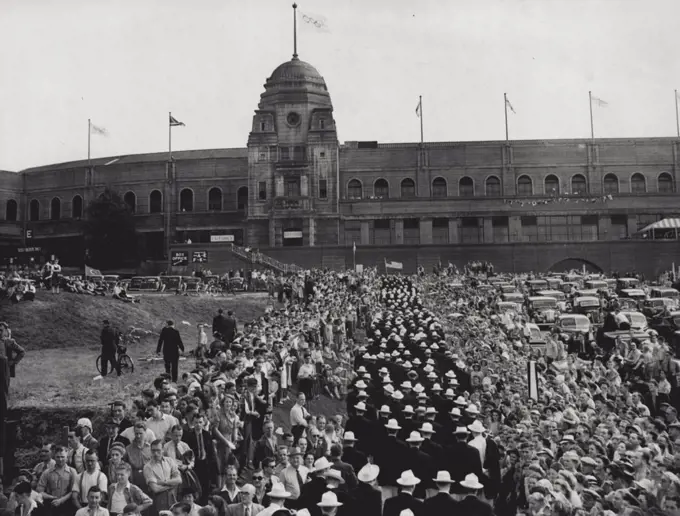 American Contingent At Olympic Wembley: The American Contingent of Olympic entrant passing through the crowd as they approach Wembley stadium, London, this afternoon, for the grand parade of competitors, signallising the opening of the 1948 Olympic Games. July 29, 1948. (Photo by Associated Press Photo).