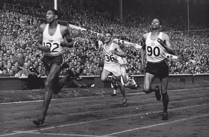 Olympic Games 1948 - ***** 400 metres final - Arthur Wint of Jamaica gaining for the British Empire the first Olympic win, when he won the Final of the 400 metres in 46.2 sec. (equalling the Olympic record) from Herbert McKenley, Jamaica, second and M. Whitfield of the U.S.A. who was third. August 05, 1948.