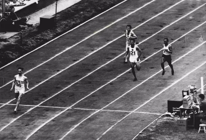 Olympic Games 1948 - Athletics - ***** The finish of Heat 2 in ***** metres, P.H. Valle of Gt. Britain ***** (86) first; J. H. De Saram ***** (21) second and B. O. ***** of Philippines (59) third. August 02, 1948.