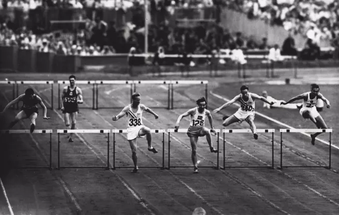 Olympic games 1948 - Athletics - R. Larsson (No. 128) taking the last hurdle in the 400-metre semi-final in which he set up an Olympic record of 51.9 secs. R. Ault, U.S.A., (No. 338) was second. July 30, 1948.