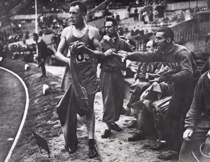 Olympic Games : Italian And French Protest - Italian and French competitors and supporters shouting protests as Louis Chevalier (France No. 365) is disqualified during heat 2 of the 10,000 metres Walk at Wembley Stadium. August 03, 1948. (Photo by Sport & General Press Agency, Limited).