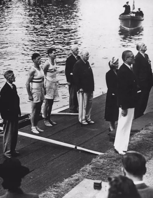 Olympic Games Rowing Finals at Henley: J. H. T. Wilson (str) and W. G. R. M. Lauris (bow) of Great Britain, standing on the landing stage during the Victory ceremony after winning the Pairs without Cox final at Henley to-day. Second was Switzerland and third Italy. August 09, 1948. (Photo by Reuterphoto).