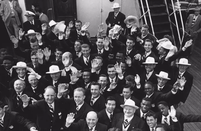 U.S. Athletes Arrive: Male members of the United States Olympic teams wave "hello" to England on their arrival at Southampton on the S. S. America. July 23, 1948. (Photo by Mirror Features).