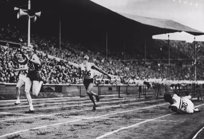 Olympic Games: Marie (France) first, Bernard of Switzerland, second, and Foster (Jamaica) third, in heat 5 of 110 metre hurdles at Wembley, to-day (Tuesday). D. Finlay of Britain falling at the last hurdle, just before the tape, was leading until his accident. August 03, 1948. (Photo by Olympic Photo Association).