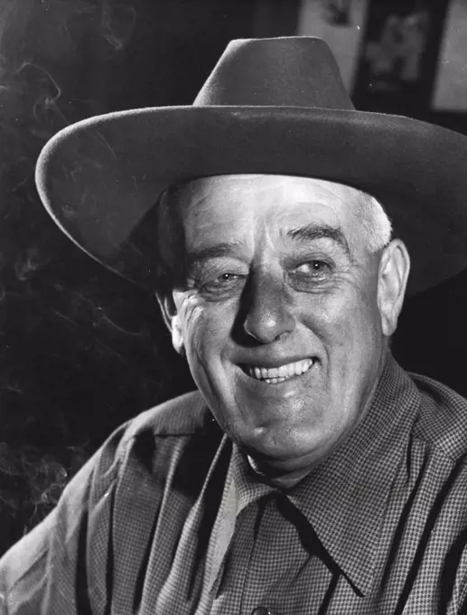 With the smile of a man whose dream has come true, William Walkley wore this red hat in Sydney's Martin Place on the day the Western Australian oil strike was announced.  January 13, 1954.