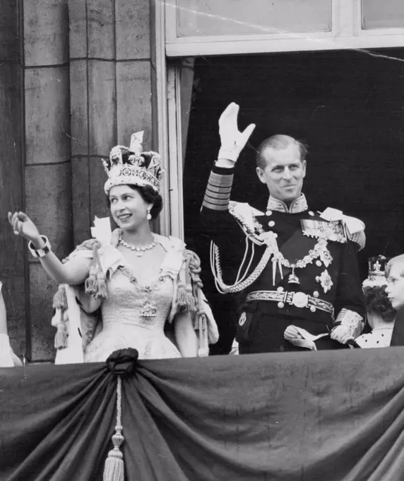 Her Happiest Day - One of the happiest picture of a happy day - the Queen, wearing the Imperial State Crown, and the Duke Edinburgh, in uniform of Admiral of the Fleet, smile and wave. From the balcony to the milling crowds pressing around the gates of Buckingham Palace after the coronation to-day (Tuesday). June 02, 1953. (Photo by Reuterphoto).