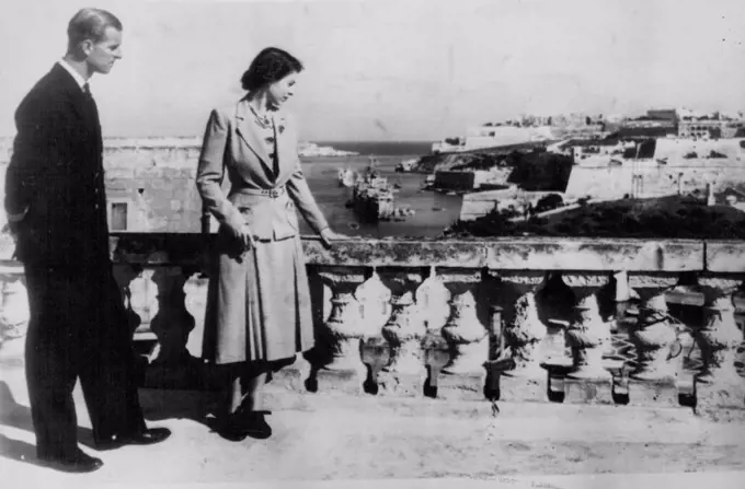 Royal Pair View Valetta Scenery -- Britain's Princess Elizabeth and the Duke of Edinburgh view Velveeta harbour and part of the town from the roof of the villa Guardamangia to-day November 23. The Princess flew out to join her seagoing husband for their second wedding anniversary three days ago. November 23, 1949. (Photo by Associated Press Photo).