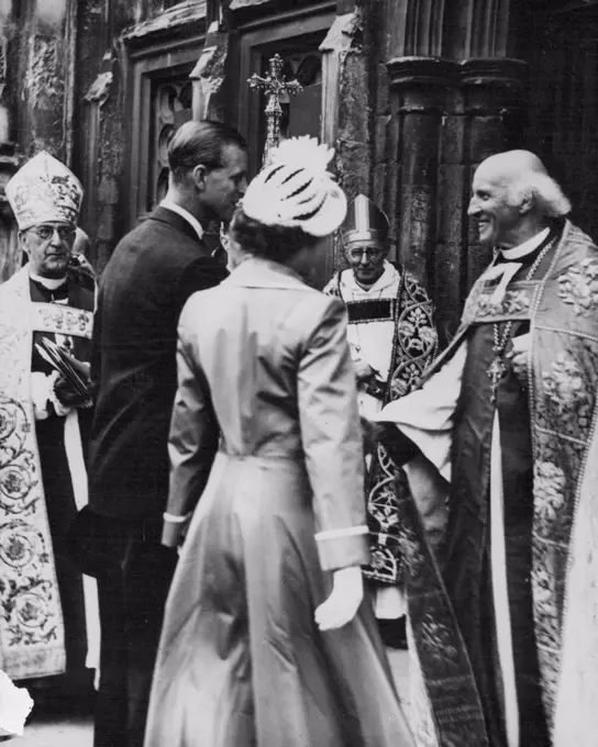 The Duke Meets the Dean -- The Very Rev, Hewlett Johnson, Dean of Canterbury, (right) receives Prince Philip at the West Door of Canterbury Cathedral, Kent, when he and Princess Elizabeth attended a service for the Kent Country playing fields Association, July 31. Prince Philip is President of the playing fields association of Great Britain. He and Princess Elizabeth were spending the week with lord and Lady Brabourne at Mersham Le watch Kent. August 12, 1949. (Photo by Associated Press Photo).