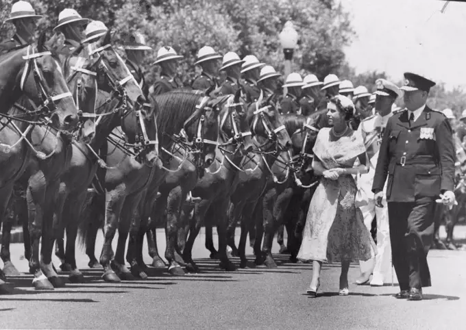 Final Inspection -- The Queen and the Duke of Edinburgh inspect a guard of mounted police, on their arrival at Government house. With the Queen is NSW police commissioner Delaney, who conducted the Queen on the inspection. February 03, 1954.